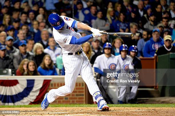Kris Bryant of the Chicago Cubs doubles in the fourth inning during Game 1 of NLDS against the San Francisco Giants at Wrigley Field on Friday,...