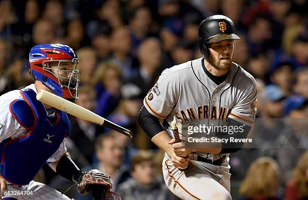 Conor Gillaspie of the San Francisco Giants breaks his bat in the fifth inning against the Chicago Cubs at Wrigley Field on October 7, 2016 in...