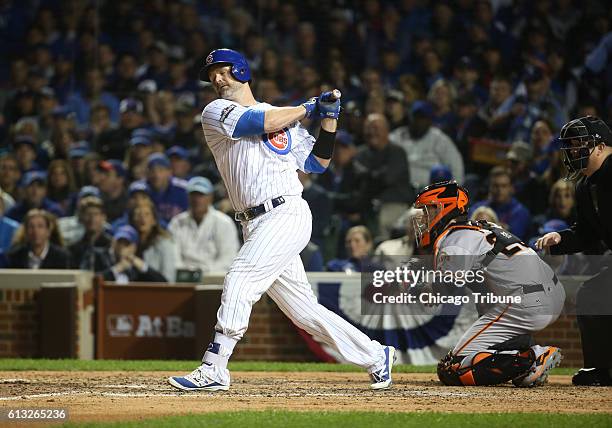 The Chicago Cubs' David Ross strikes out against the San Francisco Giants to end the fifth inning in Game 1 of the National League Division Series at...