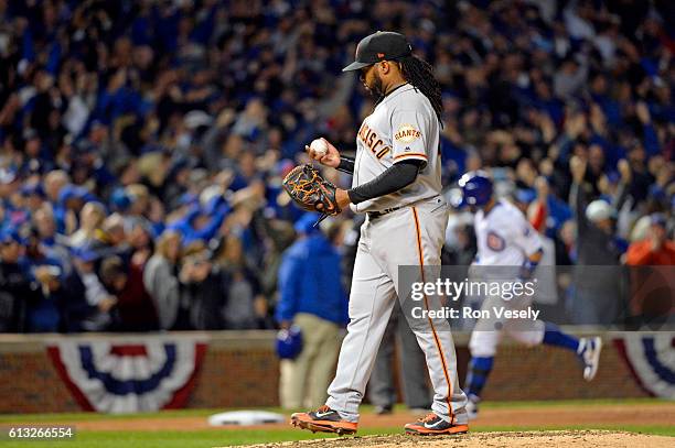 Johnny Cueto of the San Francisco Giants reacts to giving up a solo home run to Javier Baez of the Chicago Cubs in the eighth inning during Game 1 of...