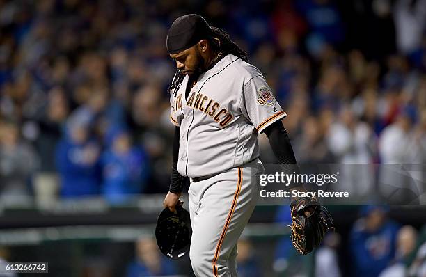Johnny Cueto of the San Francisco Giants walks off the mound in the eighth inning against the Chicago Cubs at Wrigley Field on October 7, 2016 in...