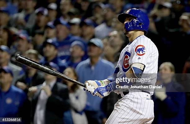 Javier Baez of the Chicago Cubs hits a home run in the eighth inning against the San Francisco Giants at Wrigley Field on October 7, 2016 in Chicago,...