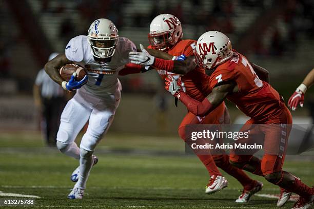 Wide receiver Cedrick Wilson of the Boise State Broncos avoids a tackle from the New Mexico Lobos at Branch Field on October 7, 2016 in Albuquerque,...