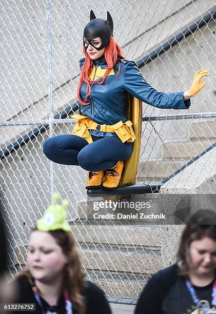 Comic Con attendee poses as Batgirl during the 2016 New York Comic Con - Day 2 on October 7, 2016 in New York City.