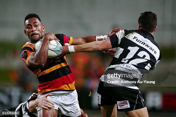 Sevu Reece of Waikato fends against Tiaan Falcon of Hawke's Bay during the round eight Mitre 10 Cup match between Waikato and Hawke's Bay at FMG...