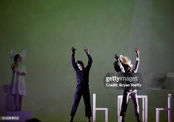 Recording artist Sia and dancers Wyatt Rocker and Maddie Ziegler perform during a stop of Sai's Nostalgic for the Present tour at the Mandalay Bay...