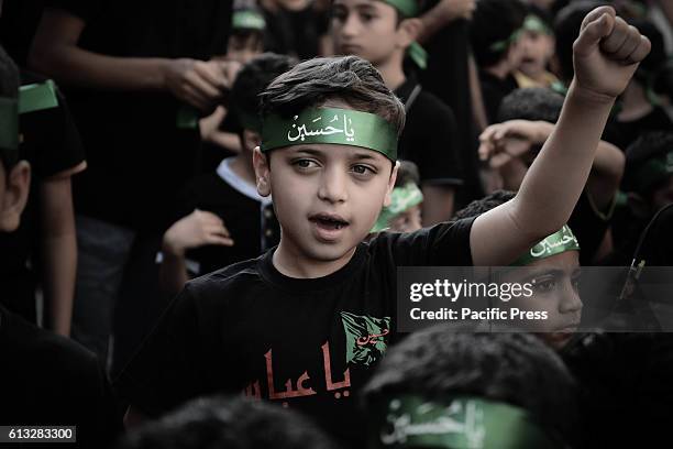 Bahraini girl in the village of Sanabis during the celebration of Ashura when Shiite Muslims who Igionh each year to commemorate the death of Imam...