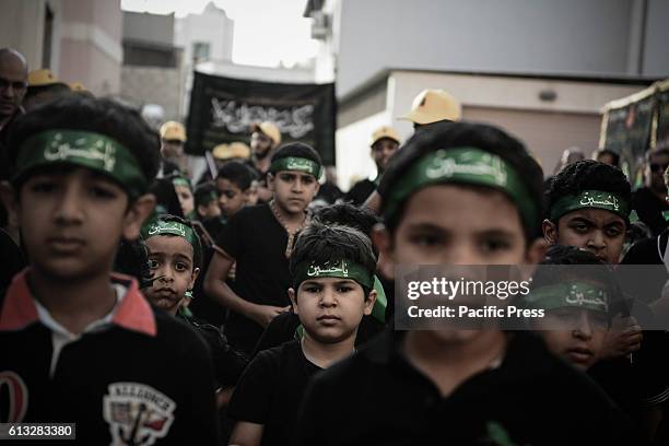 Bahraini girl in the village of Sanabis during the celebration of Ashura when Shiite Muslims who Igionh each year to commemorate the death of Imam...