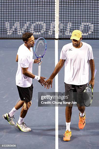 Raven Klaasen of South Africa and Rajeec Ram of United States react during the men's doubles semifinal match against Aisam-Ul-Haq Qureshi of Pakistan...