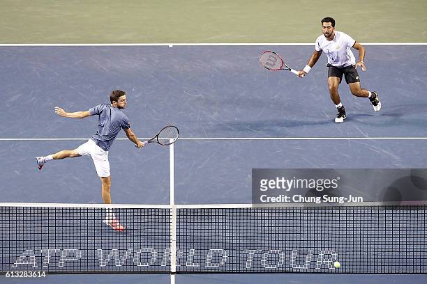Aisam-Ul-Haq Qureshi of Pakistan and Gilles Simon of France in action during the men's doubles semifinal match against Raven Klaasen of South Africa...