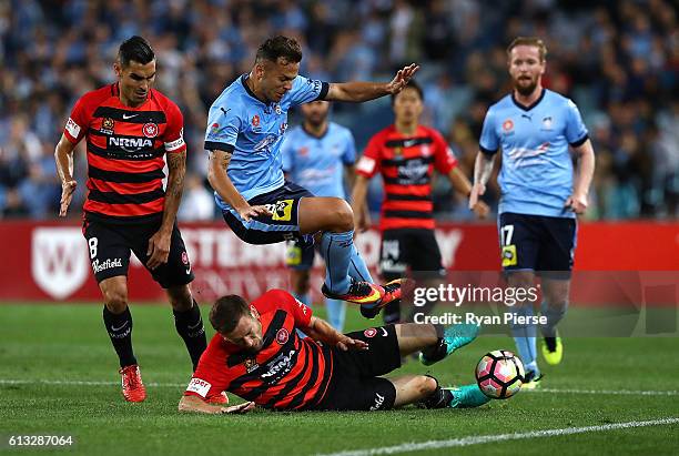 Bobo of Sydney FC is tacked by Robbie Cornthwaite of the Wanderers during the round one A-League match between the Western Sydney Wanderers and...