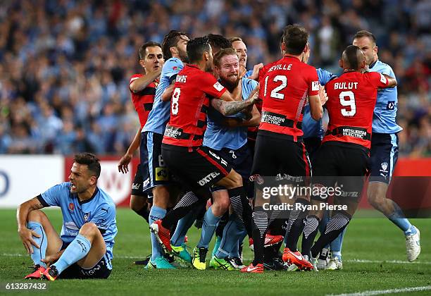 David Carney of Sydney FC clashes with Scott Neville of the Wanderers after Robbie Cornthwaite of the Wanderers tackled Bobo of Sydney FC during the...