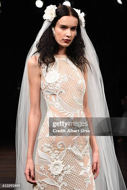 Model walks the runway at the Naeem Khan show during New York Fashion Week: Bridal at the Naeem Khan Showroom on October 7, 2016 in New York City.