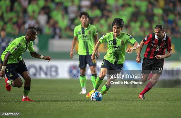 Kim Chang Soo of Jeonbuk Hyundai Motors and Dejan Damjanovic of FC Seoul action during an ACL Knockout Stage Jeonbuk Hyundai Motors vs FC Seoul match...