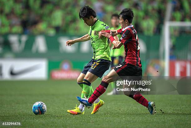 Kim Chang Soo of Jeonbuk Hyundai Motors and Ko Kwang Min of FC Seoul action during an ACL Knockout Stage Jeonbuk Hyundai Motors vs FC Seoul match at...