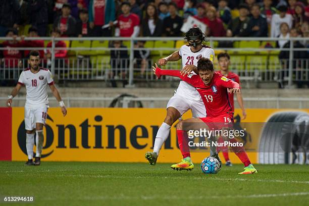 Jung Woo Young of South Korea and Sebastian Soria of Qatar action during an 2018 Russia World Cup Asian Qualifiers South Korea vs Qatar match at...