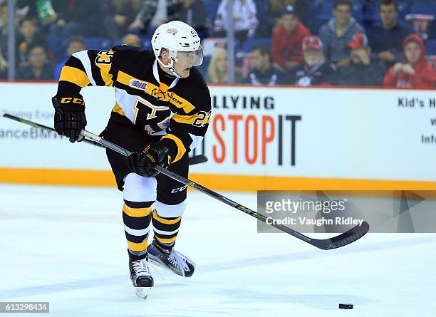 Tyler Burnie of the Kingston Frontenacs skates with the puck during an OHL game against the Niagara IceDogs at the Meridian Centre on September 30,...