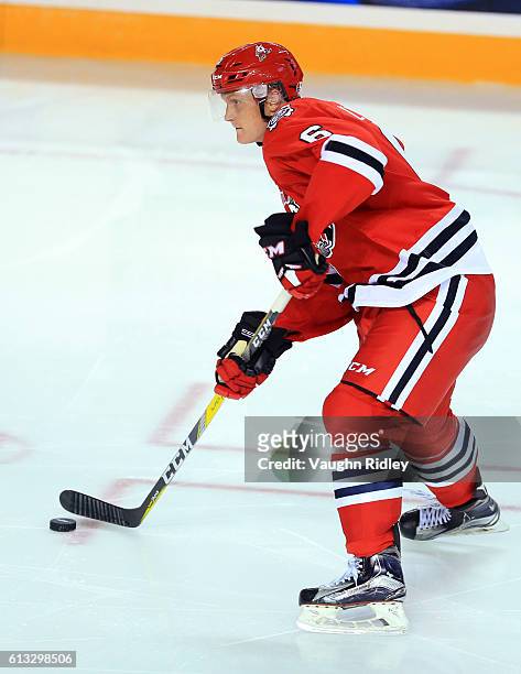Hayden Davis of the Niagara IceDogs passes the puck during an OHL game against the Kingston Frontenacs at the Meridian Centre on September 30, 2016...