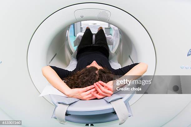 scene from oncology institute...young woman waiting for pet scan - pet scan machine 個照片及圖片檔