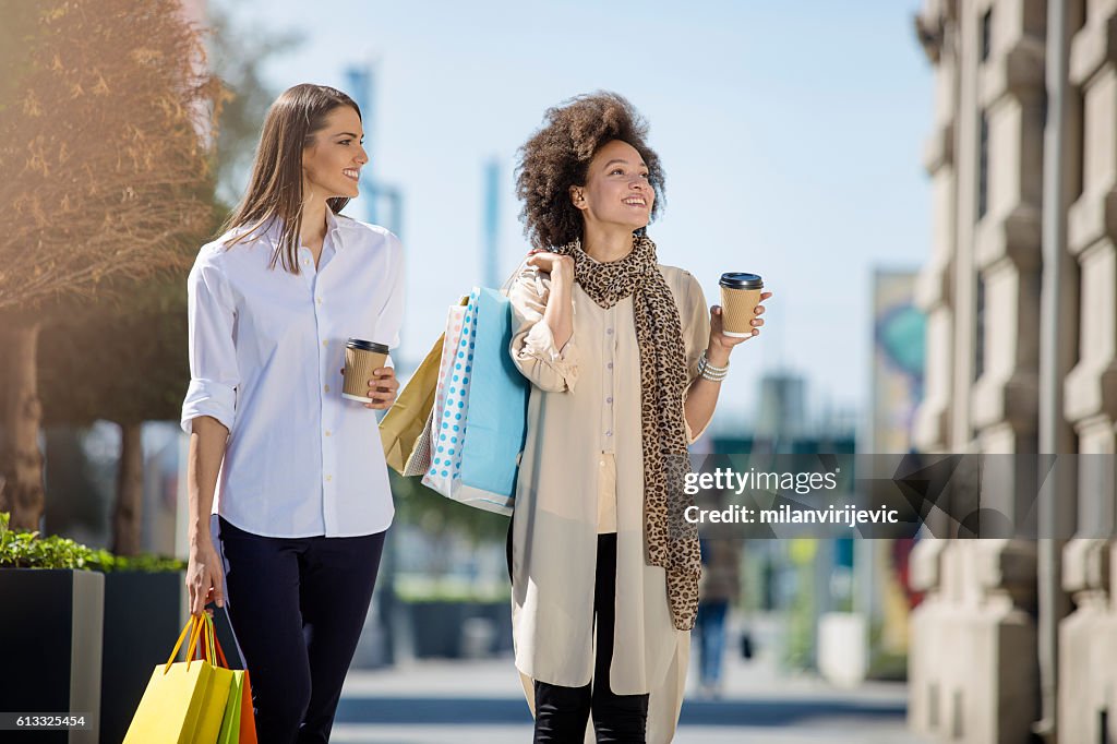Beautiful young women smiling in the mall