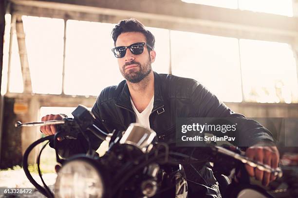 he's a hardcore rebel - motorcycle man stock pictures, royalty-free photos & images