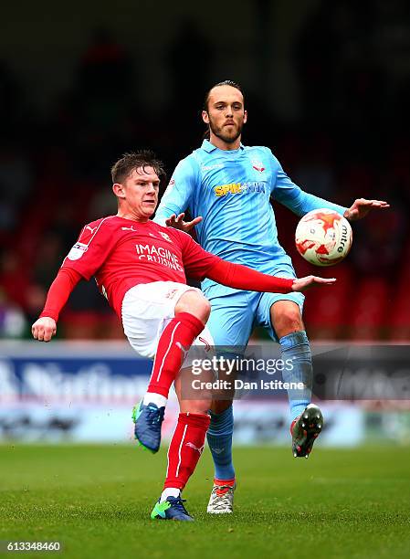 Sean Murray of Swindon Town battles for the ball with Tom Thorpe of Bolton Wanderers during the Sky Bet League One match between Swindon Town and...