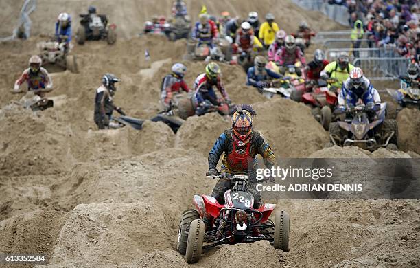 Quad rider negogiates the bumps during the Adult Quad and Sidecar race duringthe 2016 HydroGarden Weston Beach Race in Weston-super-Mare, south west...