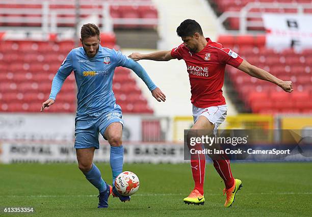 Bolton Wanderers James Henry battles with Swindon Town's Yaser Kasim during the Sky Bet League One match between Swindon Town and Bolton Wanderers at...