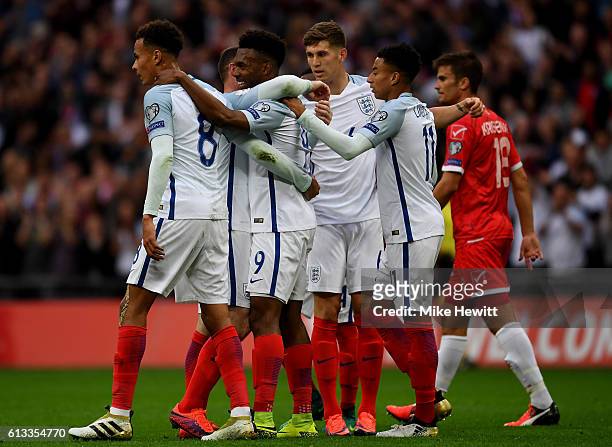 Daniel Sturridge of England celebrates with team mates after scoring the opening goal of the game during the FIFA 2018 World Cup Qualifier Group F...