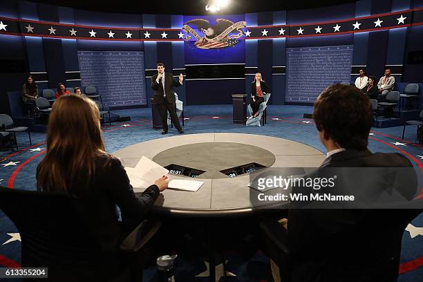 Students from Washington University rehearse as stand-ins for the second presidential debate October 8, 2016 in St. Louis, Missouri. The second...