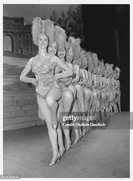 Chorus dancers known as the Tiller Girls perform at the Victoria Palace.