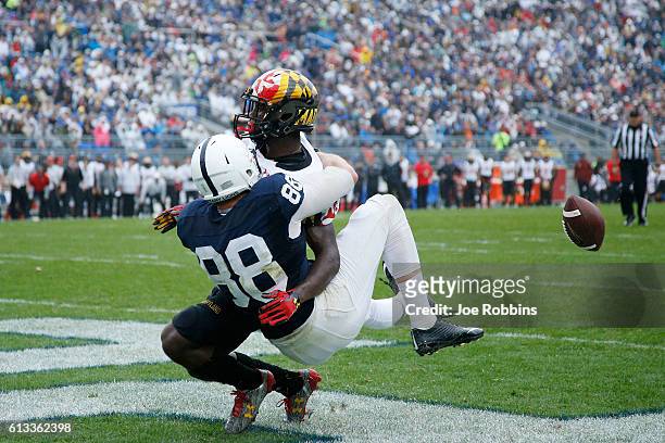 Mike Gesicki of the Penn State Nittany Lions draws a pass interference penalty in the end zone against Darnell Savage Jr. #26 of the Maryland...