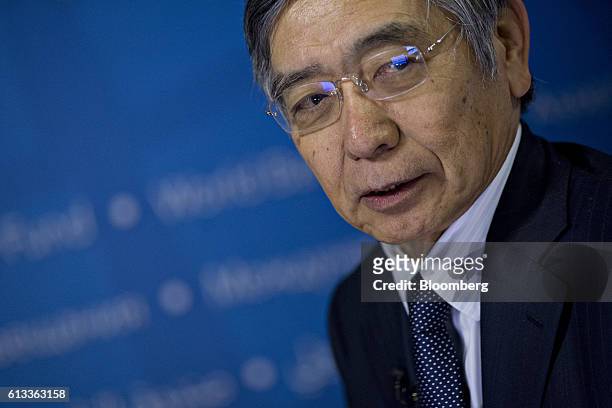 Haruhiko Kuroda, governor of the Bank of Japan , listens during a Bloomberg Television interview at the International Monetary Fund and World Bank...