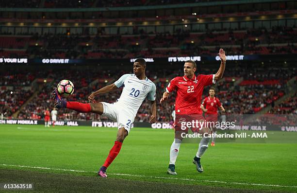 Marcus Rashford of England and Alex Muscat of Malta during the FIFA 2018 World Cup Qualifier between England and Malta at Wembley Stadium on October...