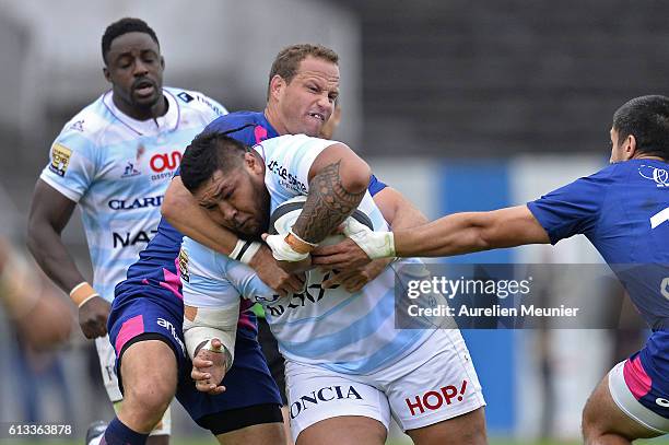 Ben Tameifuna of Racing Metro 92 is tackled by Herman Bosman of Stade Francais during the Top 14 match between Racong Metro 92 and Stade Francais on...