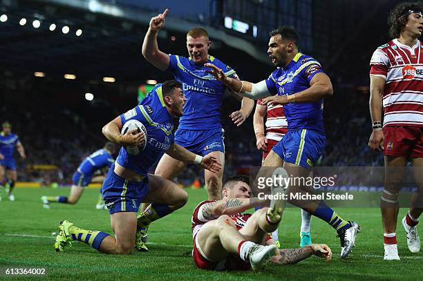 Declan Patton of Warrington celebrates scoring the opening try during the First Utility Super League Final between Warrington Wolves and Wigan...