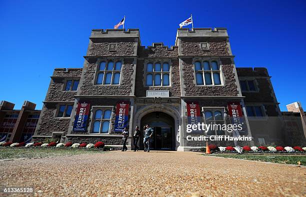 People walk from the Sumers entrance during preparations for the second presidential debate at Washington University on October 8, 2016 in St Louis,...