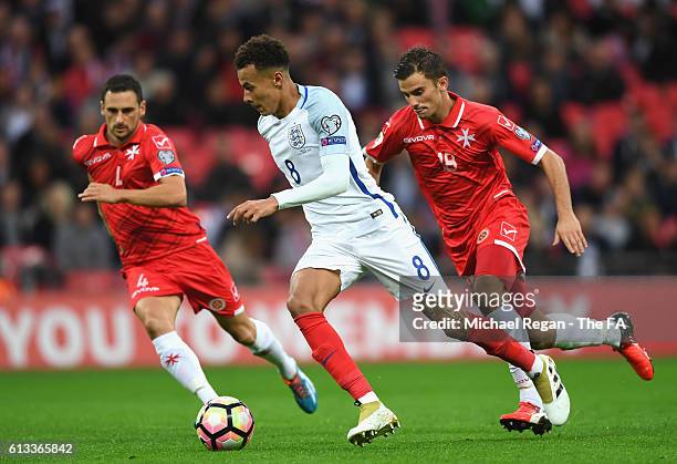 Dele Alli of England is chased by Paul Fenech of Malta during the FIFA 2018 World Cup Qualifier Group F match between England and Malta at Wembley...