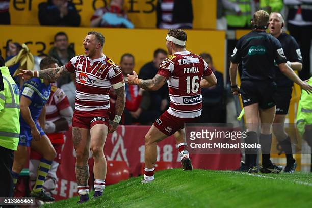 Josh Charnley of Wigan celebrates scoring his sides second try alongside Sam Powell during the First Utility Super League Final between Warrington...