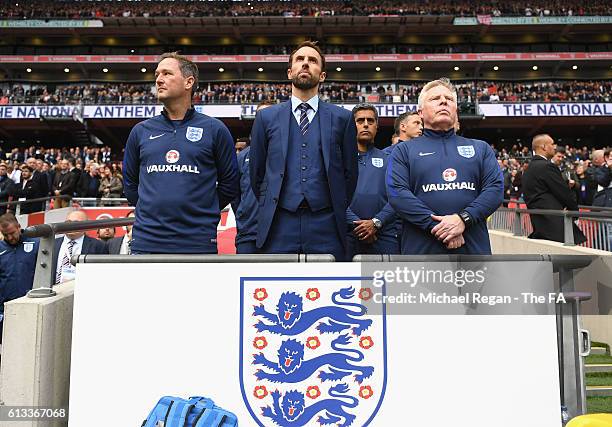 Gareth Southgate, Interim Manager of England poses with Steve Holland and Sammy Lee during the FIFA 2018 World Cup Qualifier Group F match between...