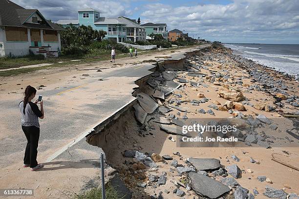 Is seen after ocean waters stirred up by Hurricane Matthew washed away part of the ocean front road on October 8, 2016 in Flagler Beach, Florida....