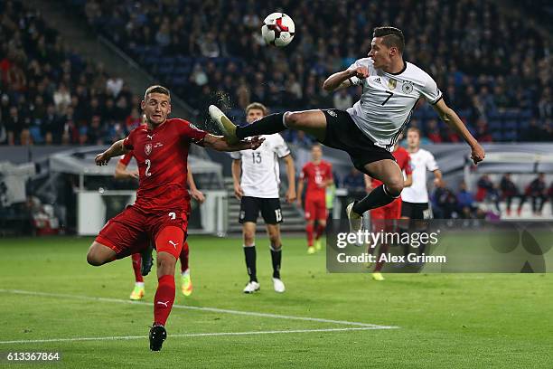 Julian Draxler of Germany is challenged by Pavel Kaderabek of Czech Republic during the FIFA World Cup 2018 qualifying match between Germany and...