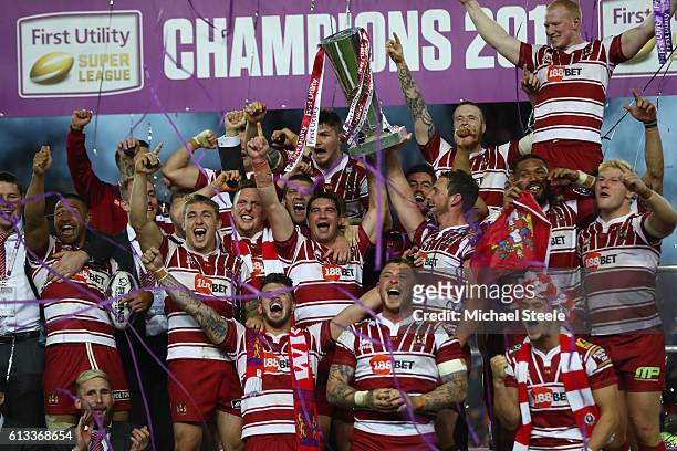 Sean O'Loughlin and Matty Smith of Wigan lift the winners trophy after their sides 12-6 victory during the First Utility Super League Final between...