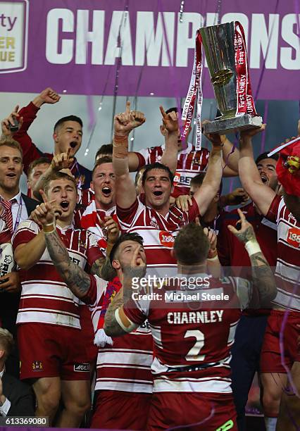 Matty Smith of Wigan lifts the winners trophy after their sides 12-6 victory during the First Utility Super League Final between Warrington Wolves...