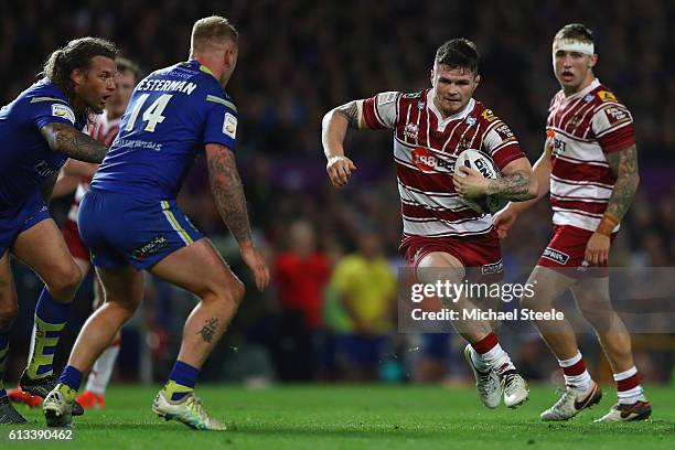 John Bateman of Wigan runs at Joe Westermam of Warrington during the First Utility Super League Final between Warrington Wolves and Wigan Warriors at...