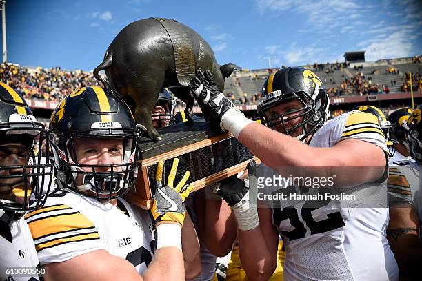 Iowa celebrate a win of the game against Minnesota with Floyd of Rosedale Trophy on October 8, 2016 at TCF Bank Stadium in Minneapolis, Minnesota....