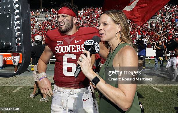 Fox Sports sideline reporter Shannon Spake interviews Baker Mayfield of the Oklahoma Sooners after a 45-40 win against the Texas Longhorns at Cotton...