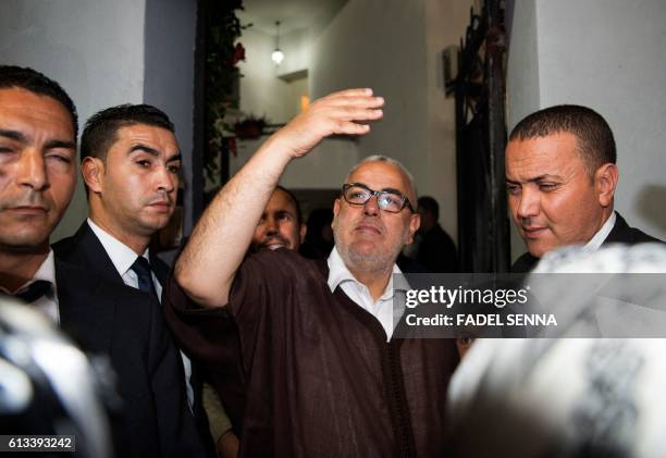 Moroccan Prime Minister and Secretary General of the ruling Islamist Justice and Development Party , Abdelilah Benkirane waves to supporters outside...