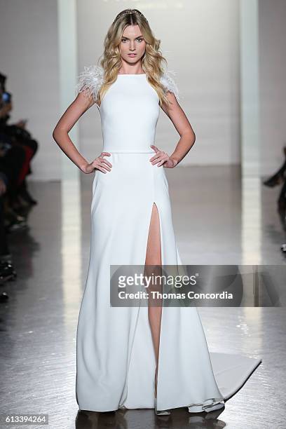 Model walks the runway wearing Pronovias Bridal at Prince George Ballroom on October 8, 2016 in New York City.