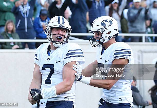 Taysom Hill of the Brigham Young Cougars celebrates a fourth quarter touchdown during the game against the Michigan State Spartans at Spartan Stadium...